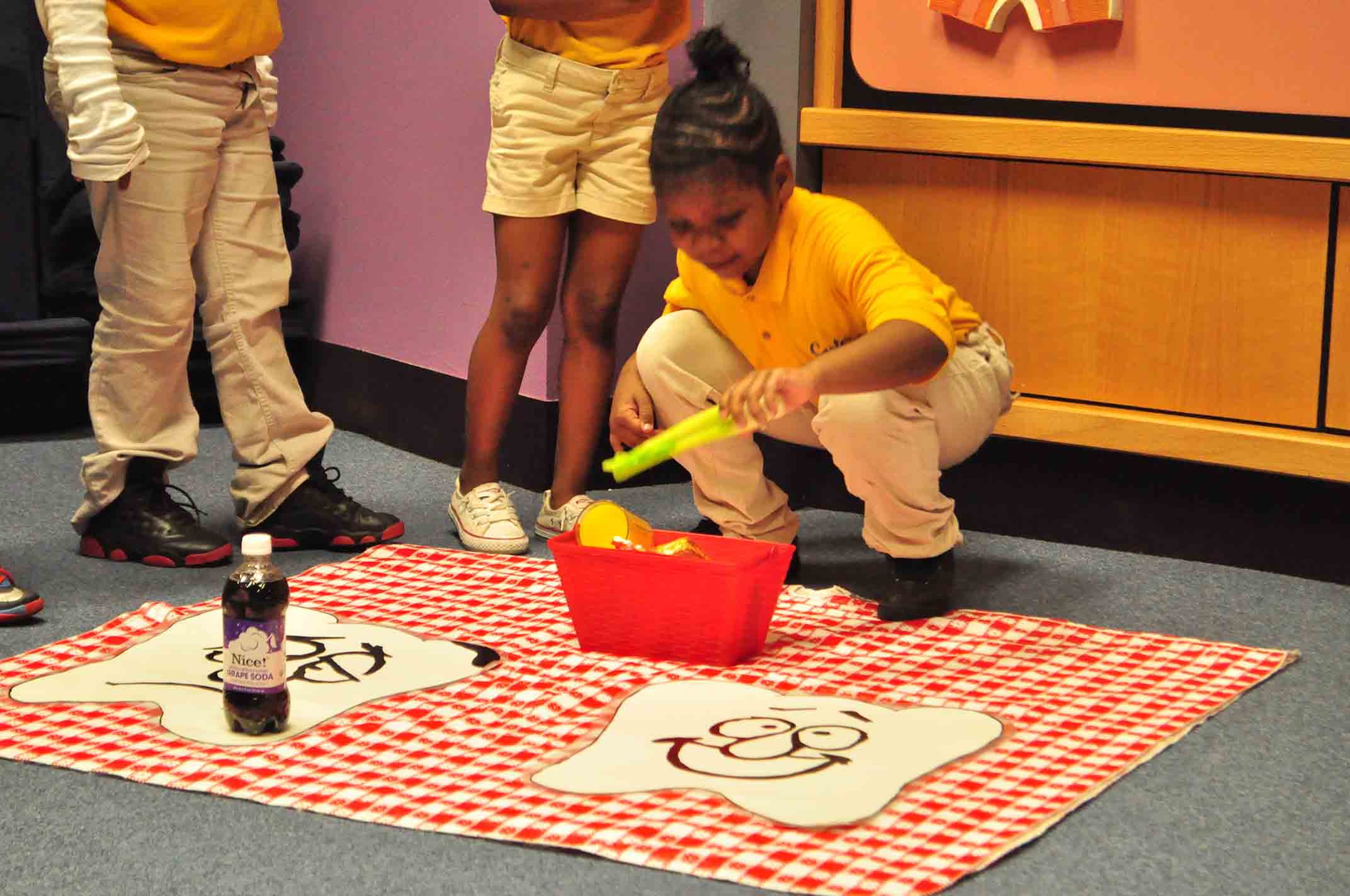 Students at the Poe Center sort foods that are good and bad for your teeth.