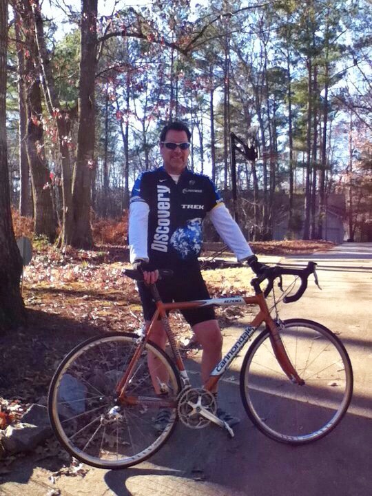 Photo of Tex Bennett and his bicycle.