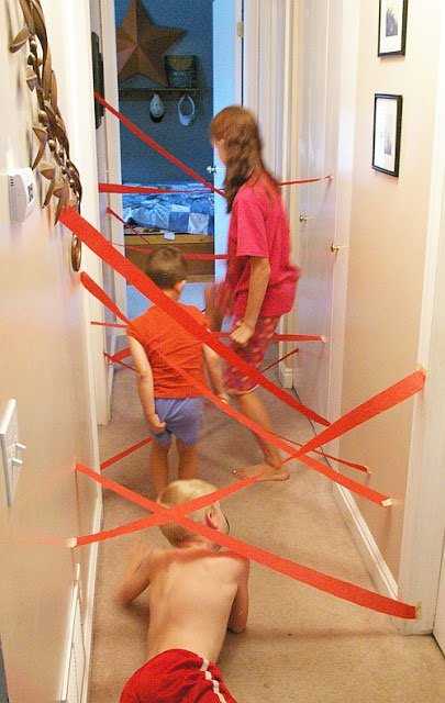 Kids playing with a homemade indoor maze.
