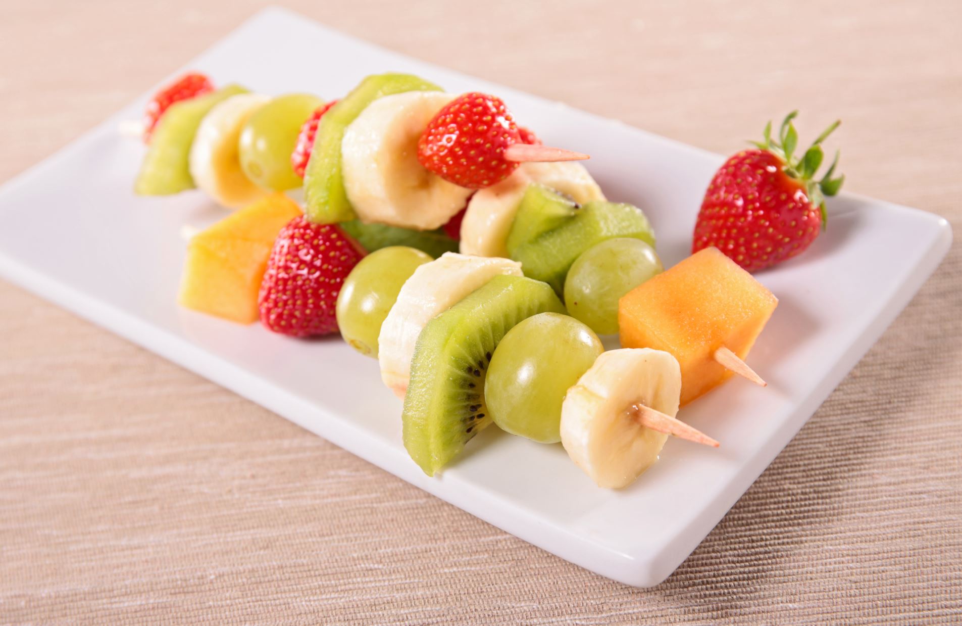 Pieces of colorful fruit on a skewer