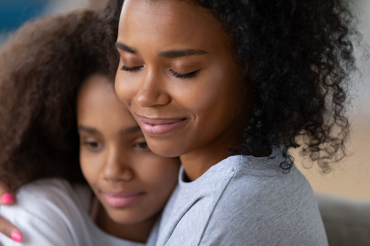 Close Up Of Black Mom Hugging Teenage Daughter › Poe Center For Health 