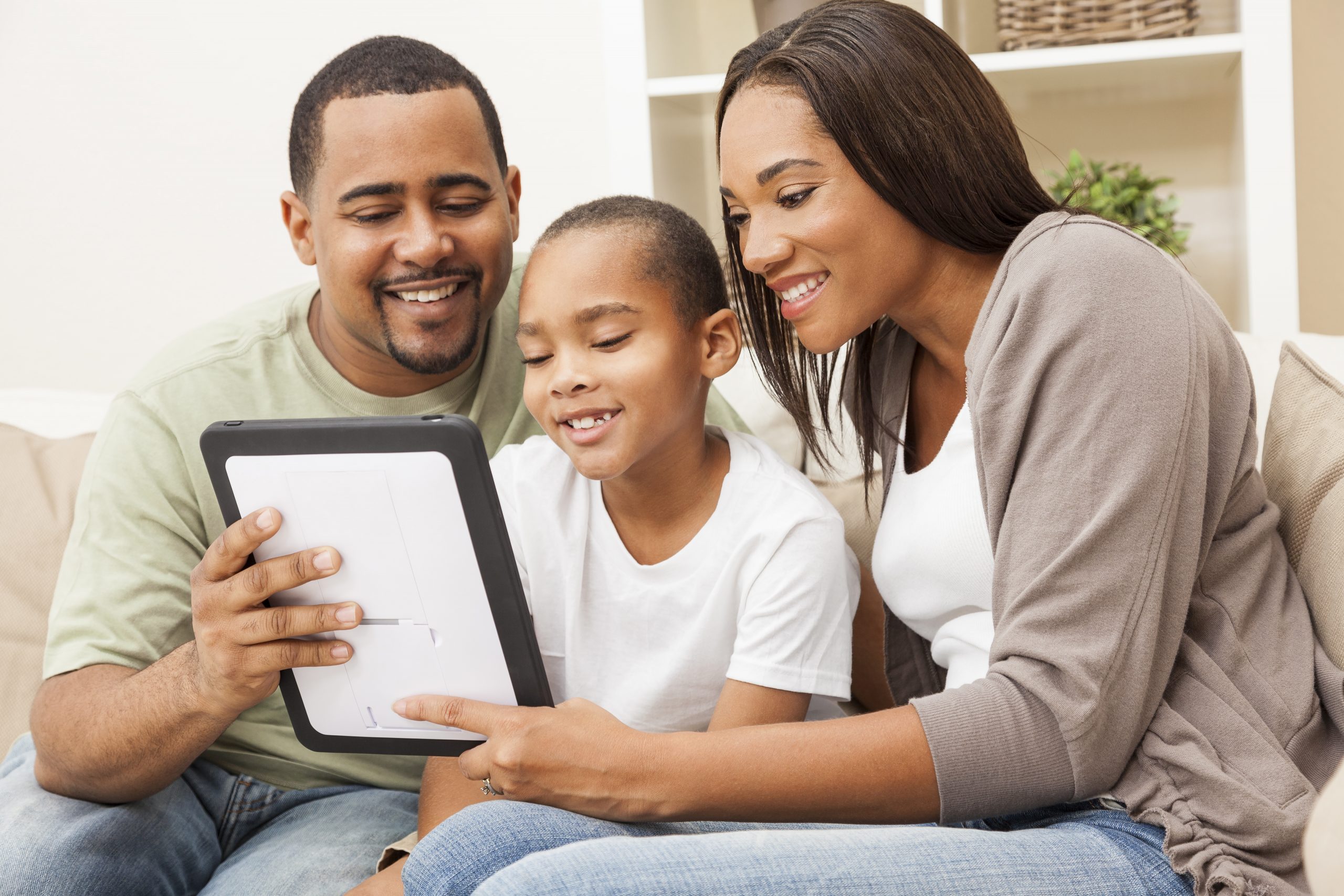 Family looking at iPad together
