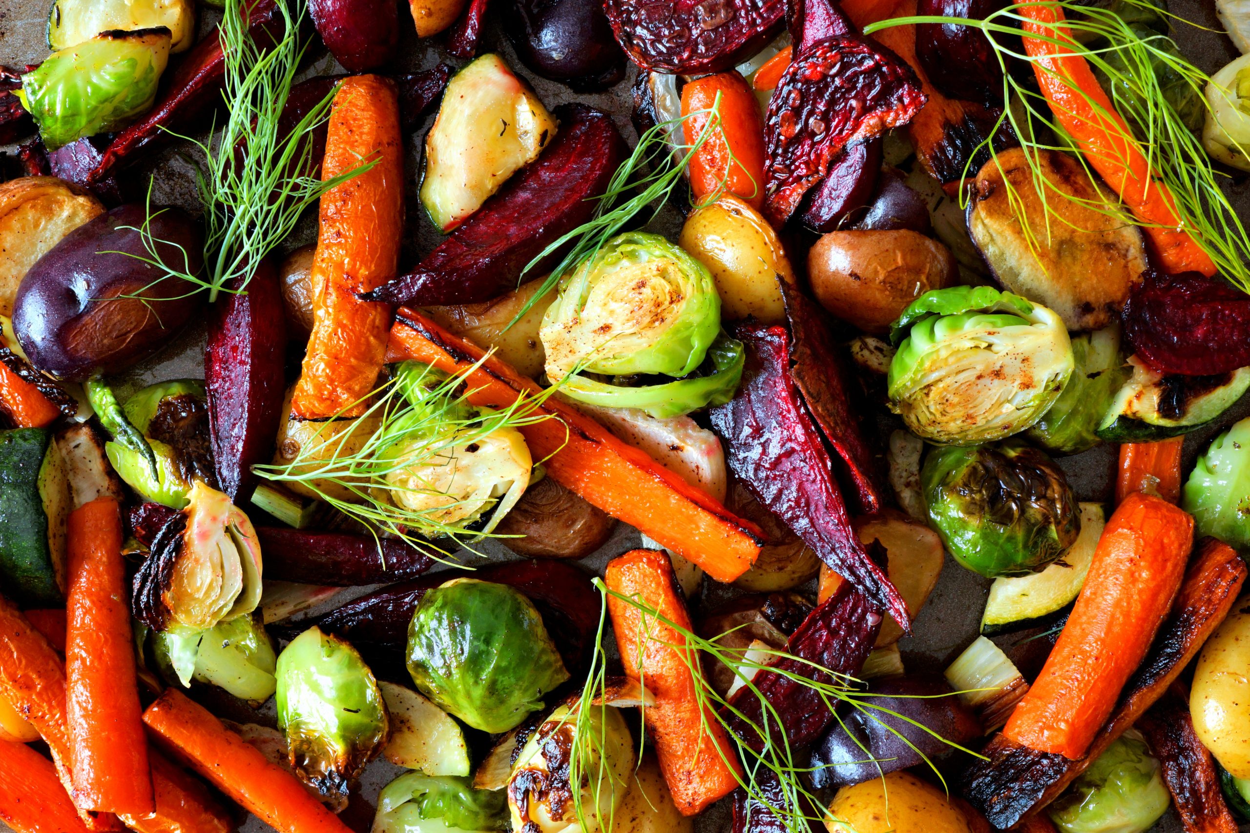 Full background of roasted colorful autumn vegetables, above view