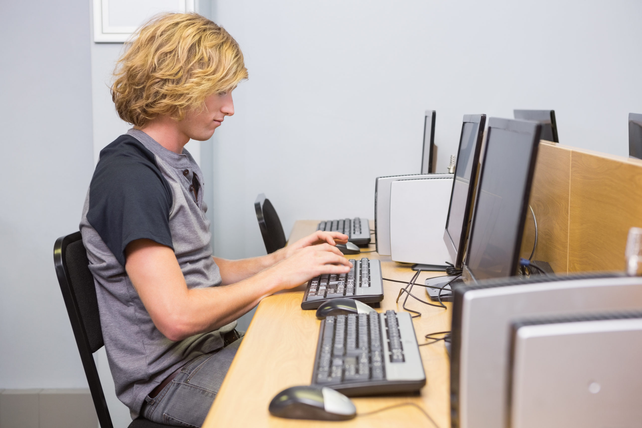 Student working on computer in classroom