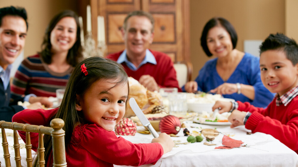 Multi Generation Family Celebrating With Holiday Meal