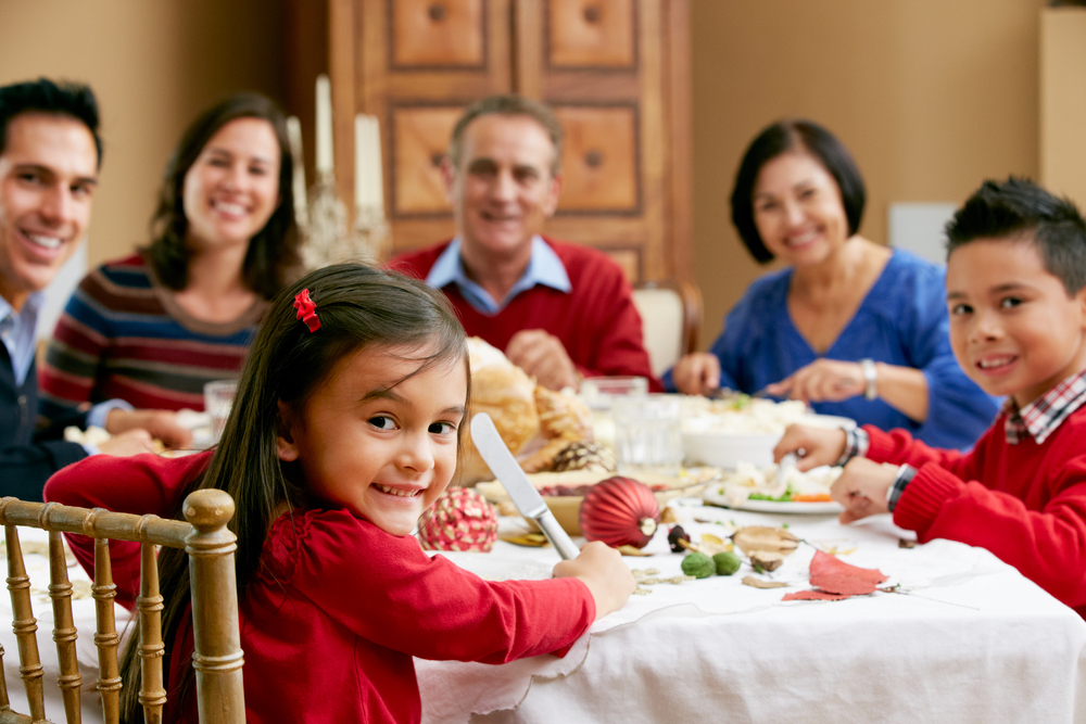 Multi Generation Family Celebrating With Holiday Meal