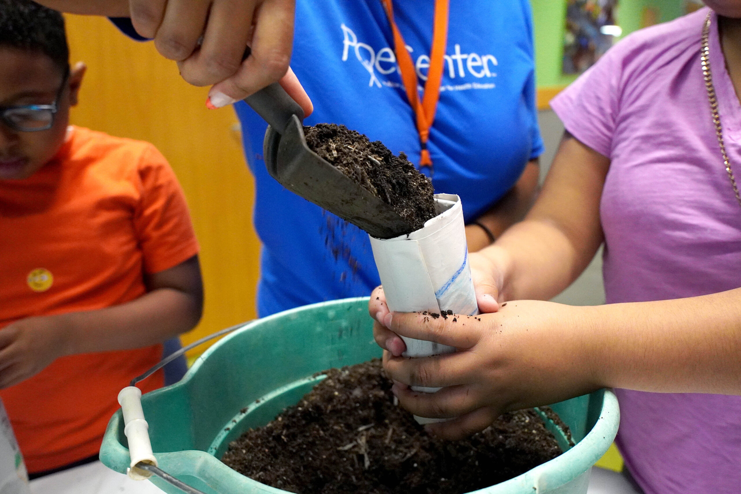 A happy camper samples delicious and healthy veggies in the Poe Center CookWELL Kitchen during Healthy Habits Camp 2025.