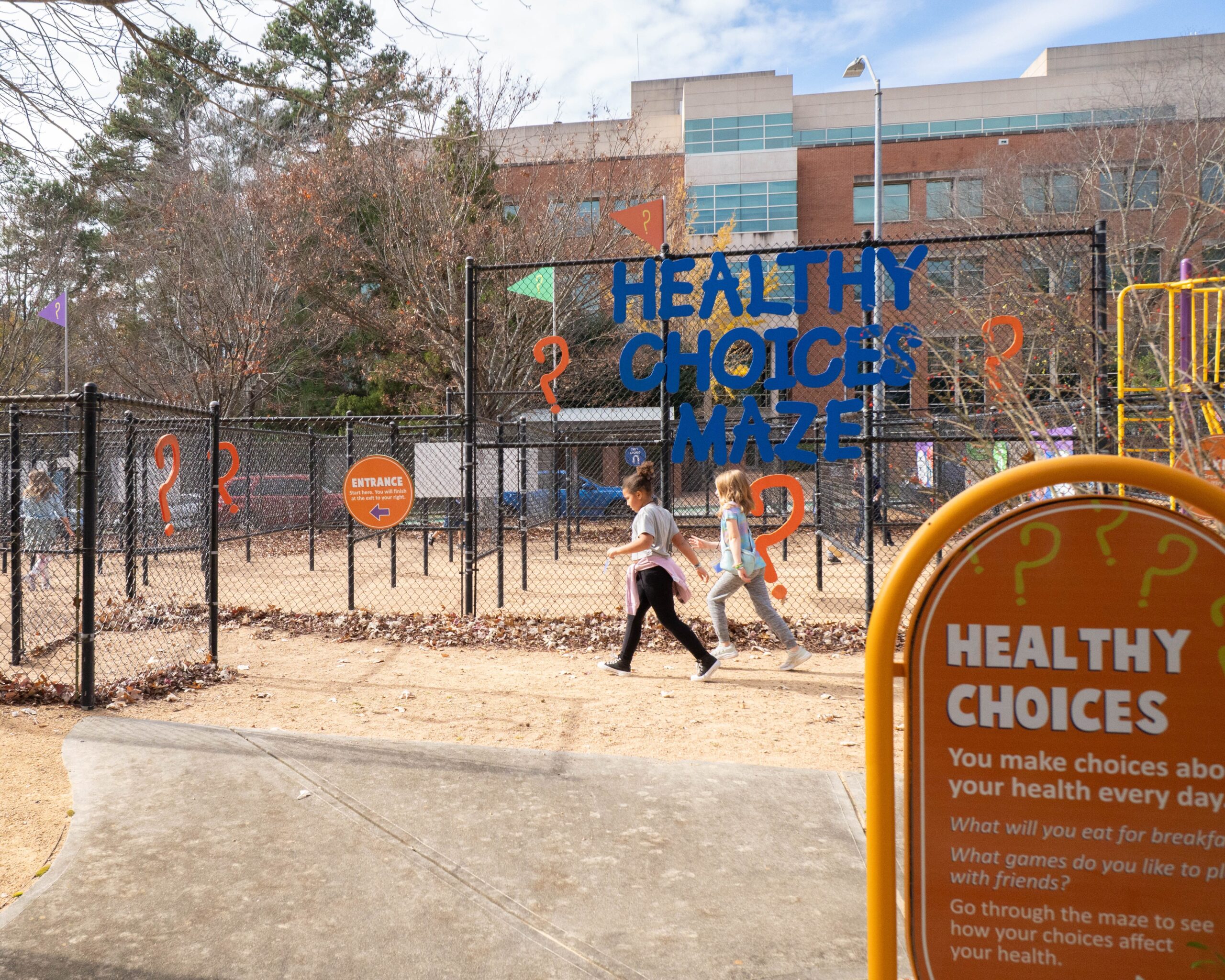 Child explores the Traffic Safety Course at the Poe Center during Camp PlayWELL