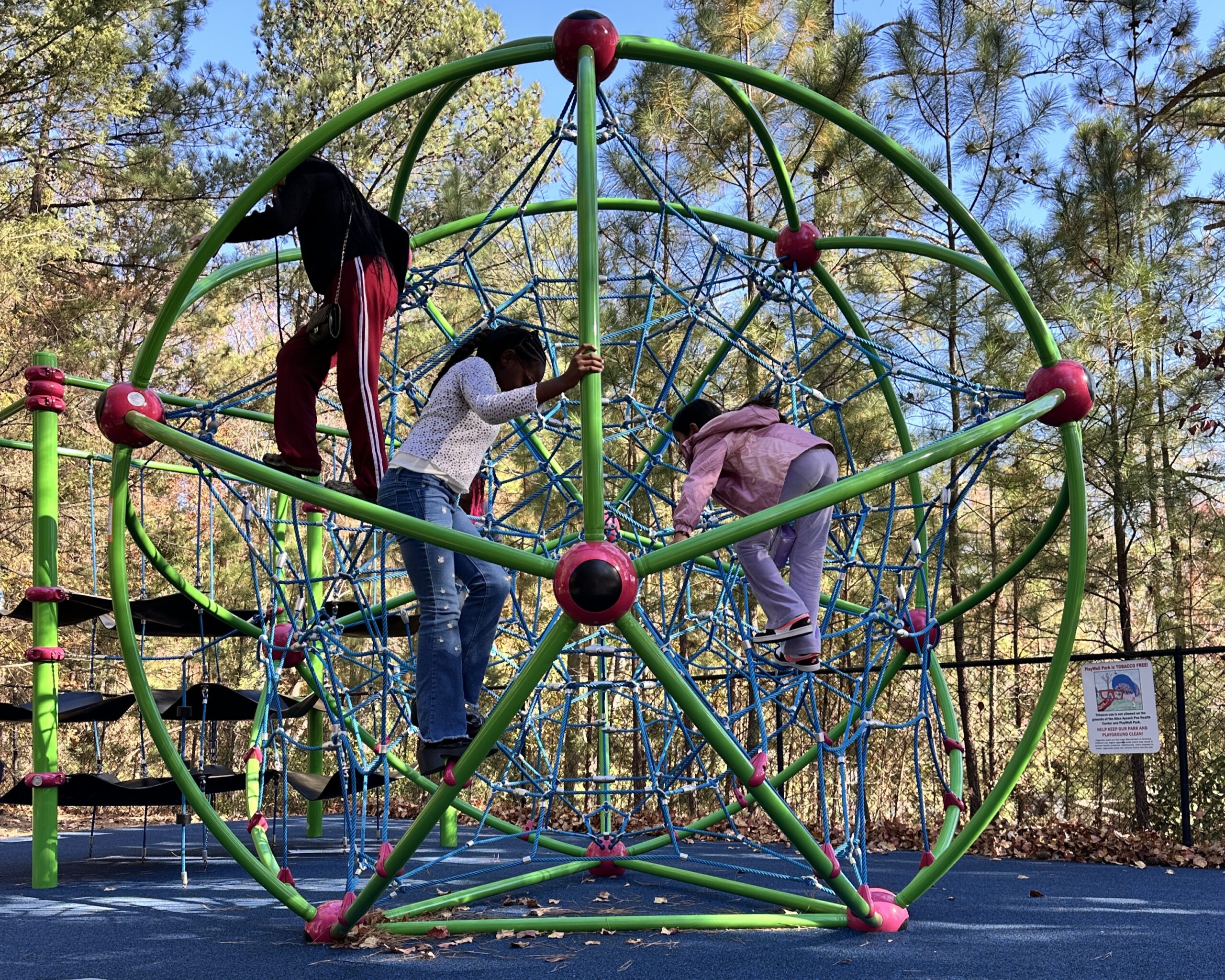 Child explores the Traffic Safety Course at the Poe Center during Camp PlayWELL