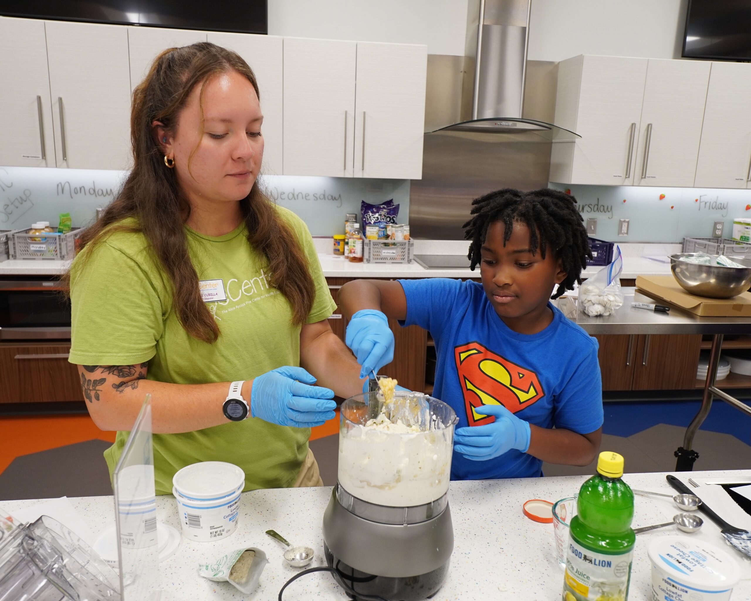 Child explores the Traffic Safety Course at the Poe Center during Camp PlayWELL