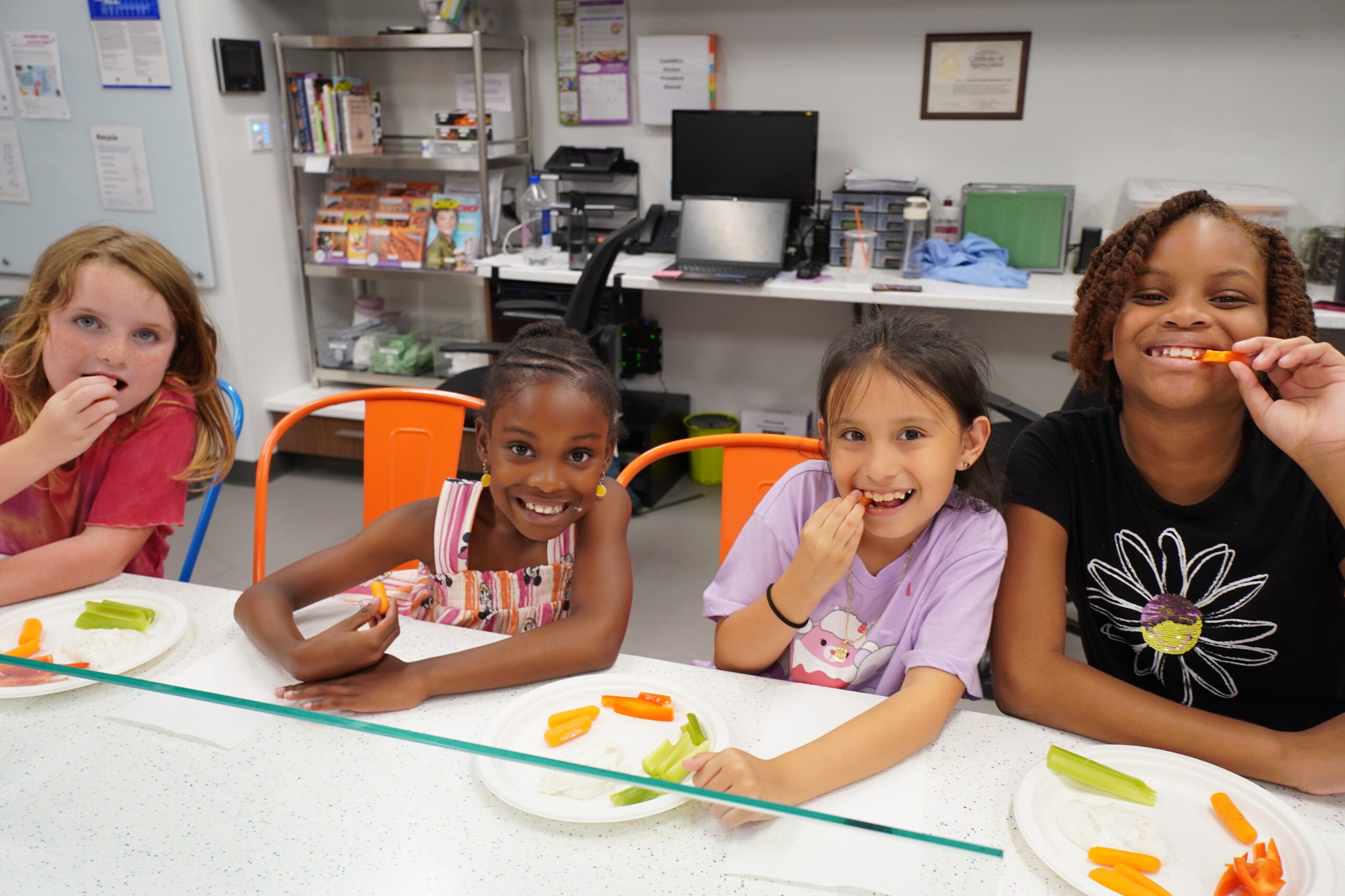 Child explores the Traffic Safety Course at the Poe Center during Camp PlayWELL