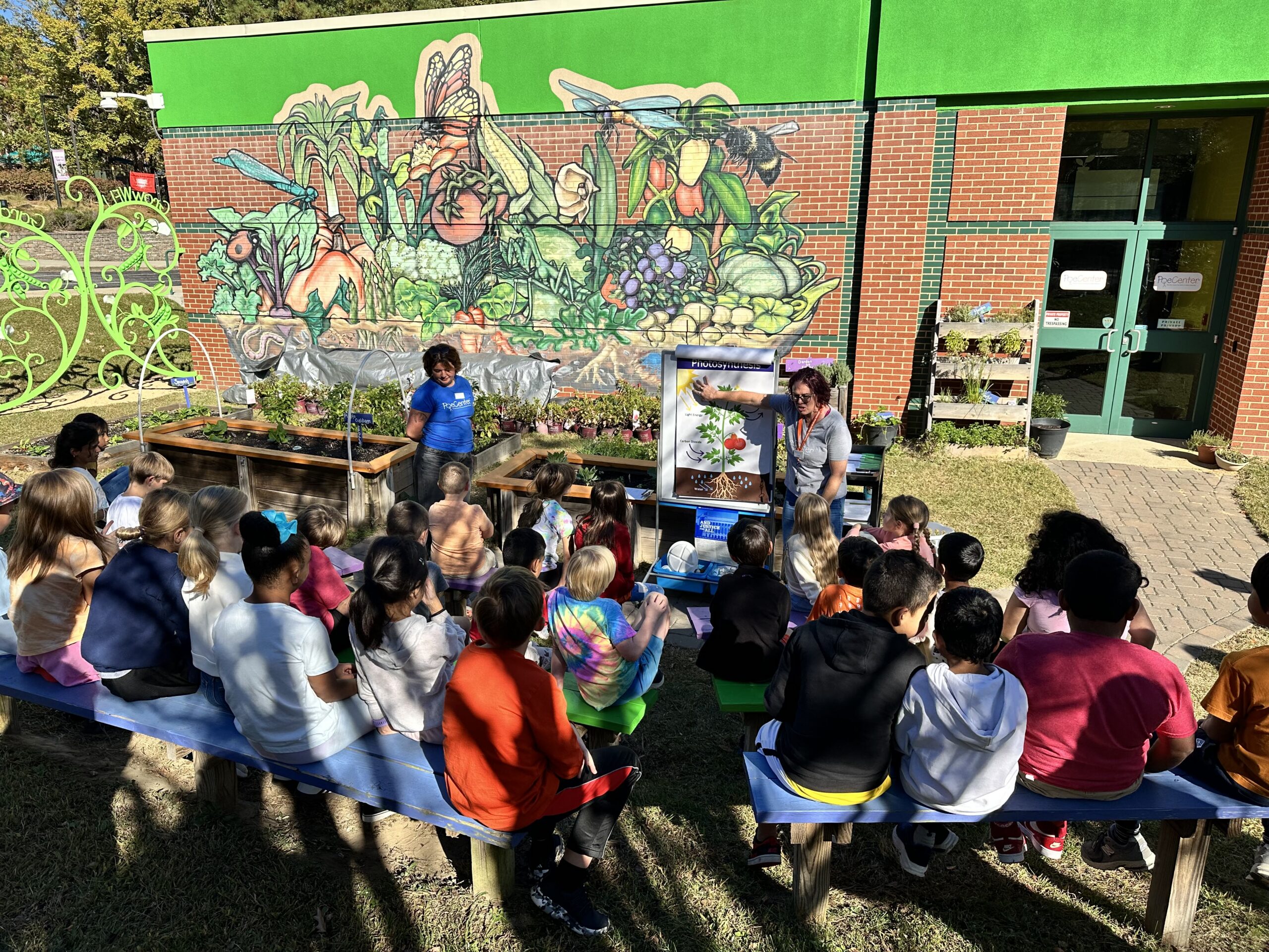 Children playing under a tent at Camp PlayWELL
