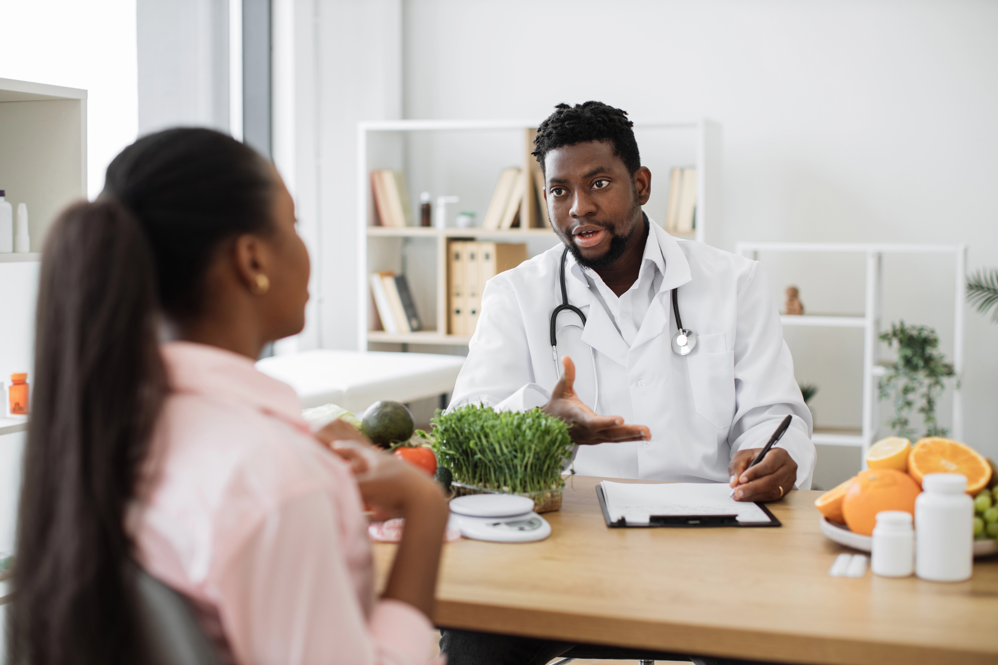 a woman talks with a doctor